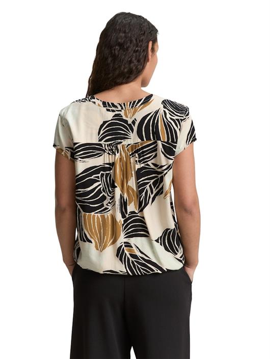 bluse-mit-muster-neutral-cut-leaves-design