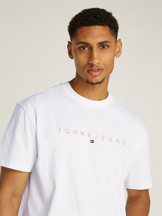 tjm-reg-gold-linear-logo-tee-ext-white